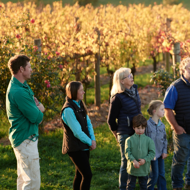 Winemaker Nick Farr, far left, with family and friends in the vineyard.