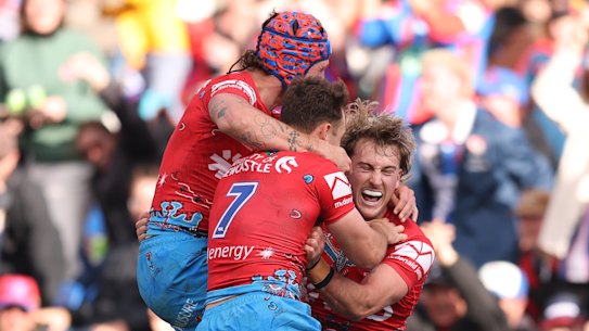 The Knights celebrate  Fletcher Sharpe’s spectacular try on Sunday.