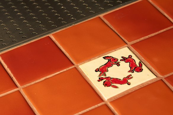 The tiled bar top includes some tiles with illustrations drawn by the team.