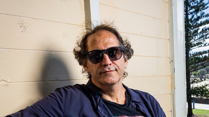 On a bench by the beach, one of Australia’s funniest writers is working it out