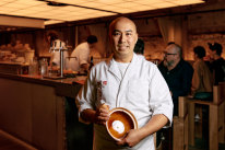 Chef Benny Lam pictured at his Central restaurant with the claypot he uses to cook rice at home.
