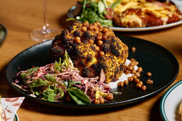 Whole roasted spiced cauliflower with fried chickpeas, whipped feta,
za’atar and quick pickled cabbage.
