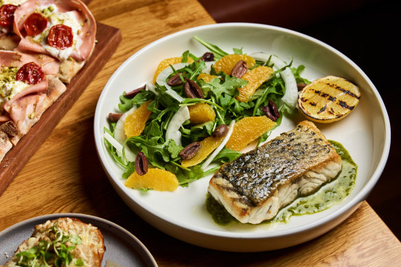 Market fish with salsa verde, orange fennel and balck olive salad, and grilled lemon.