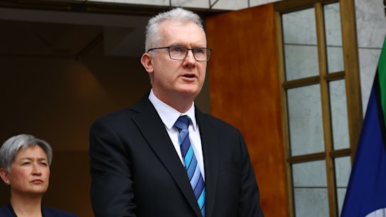 Home Affairs Minister Tony Burke speaks at Parliament House on Tuesday, beside Prime Minister Anthony Albanese, Foreign Affairs Minister Penny Wong and ASIO Director-General Mike Burgess.