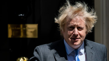 Prime Minister Boris Johnson is reopening the economy but says he will not hesitate to reimpose restrictions if the virus flares.