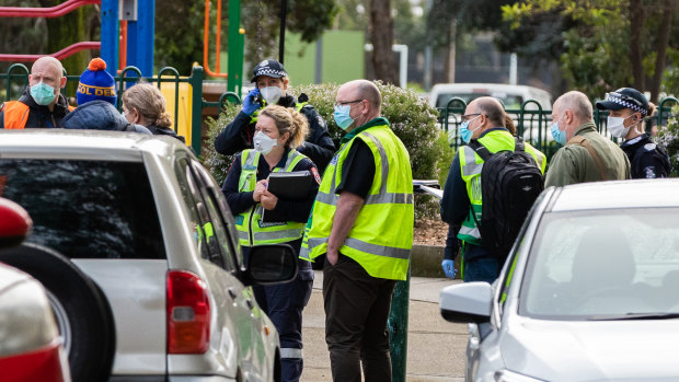 Medics are seen outside the public housing flats in Flemington as they are briefed on July 05, 2020.