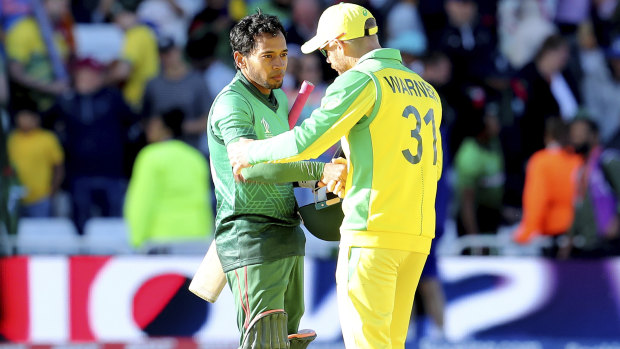 Good spirits: David Warner shakes hands with Bangladesh's Mushfiqur Rahim.