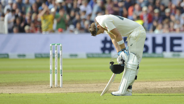 A relieved Steve Smith rests after after scoring a century during day one of the first Ashes Test.