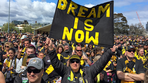 Richmond fans celebrate at Punt Road Oval on Sunday.