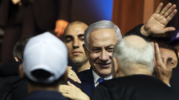 Israeli Prime Minister Benjamin Netanyahu greets attendees at the Likud party headquarters in Tel Aviv, Israel. 