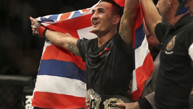 Ruled out: Max Holloway celebrates after defeating Anthony Pettis.