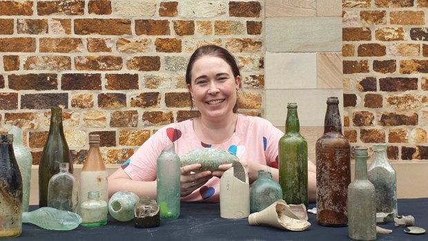 Urbis archeologist Holly Maclean with some artefacts found at the $3.6 billion Queen's Wharf Brisbane development site.