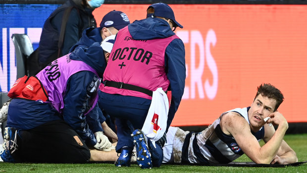 Geelong’s medical staff examine star forward Jeremy Cameron’s hamstring.