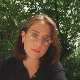 Actress Kate Ritchie studying between takes on the set of Home and Away.