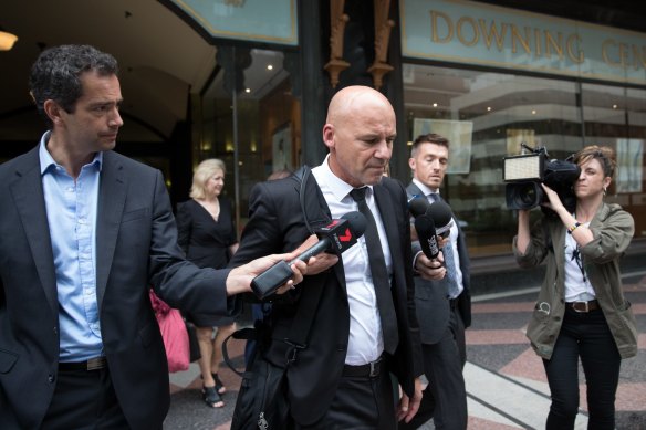 Former detective Gary Jubelin leaves Downing Centre Court on Thursday.