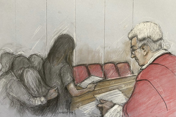 A court artist’s drawing of the parent of one of Letby’s victims reading a victim impact statement in court.