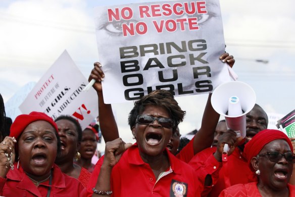 Women attend a demonstration calling on the government to rescue the kidnapped girls.