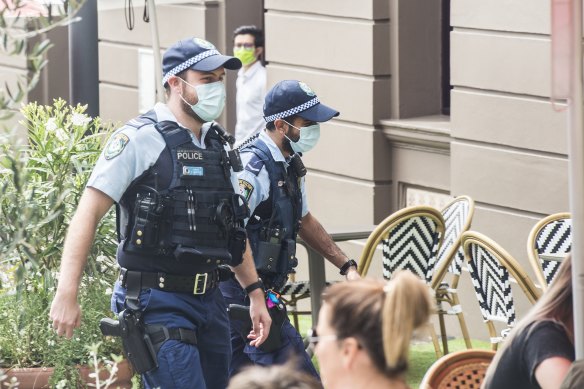 Police wearing masks in Sydney's CBD on Monday.