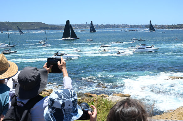 People watch the start of the Sydney to Hobart Yacht race from South Head in Sydney Harbour.