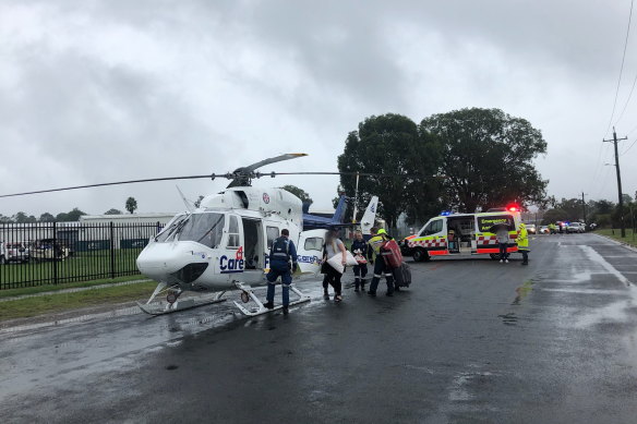 A pregnant woman in labour was airlifted to hospital after floodwaters blocked the road.