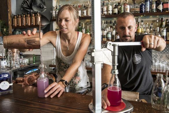 Tess Robens and Fabrizio Culici from The Rio in Sydney’s Summer Hill bottle cocktails for home delivery. 