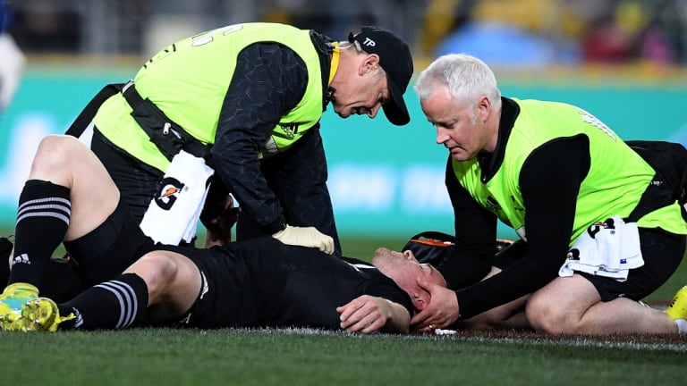 Concussion risk: Ryan Crotty receives assistance in Bledisloe I after suffering a head knock.
