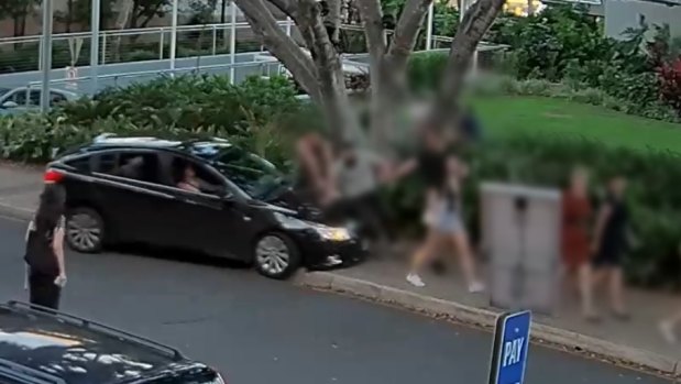 The moment a car mounts the footpath and heads towards four pedestrians in South Bank.