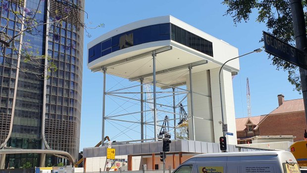 Queen's Wharf workers raise display suite seven storeys ahead of opening