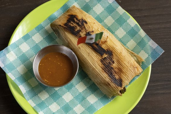 The filling of the tamales changes week to week. Often it’s Oaxacan pork served with salsa verde.