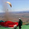 Paraglider landed 180km away after being thrown off cliff by dust devil