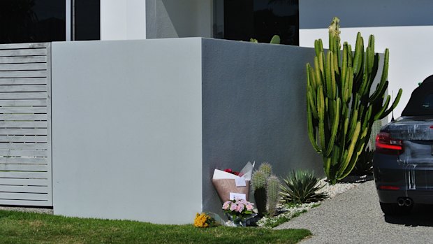 Flowers placed outside the home of Zdravko Bilic, where he was found dead on Monday.