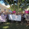 UQ staff rally against 'Hunger Games-style' fight for roles