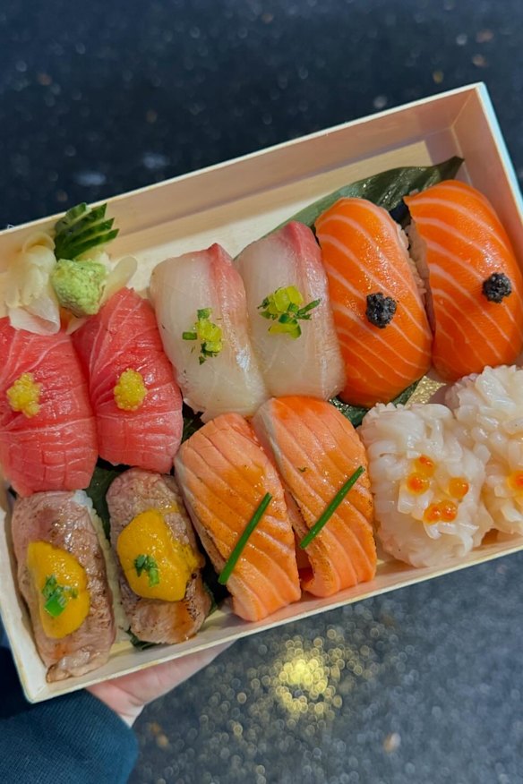 Elka dry-ages and slices a range of fish to make boxes of nigiri to go.
