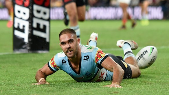 William Kennedy opens the try-scoring for the Sharks against South Sydney.