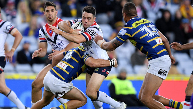 Linchpin: Cooper Cronk is tackled by Corey Norman at ANZ Stadium.