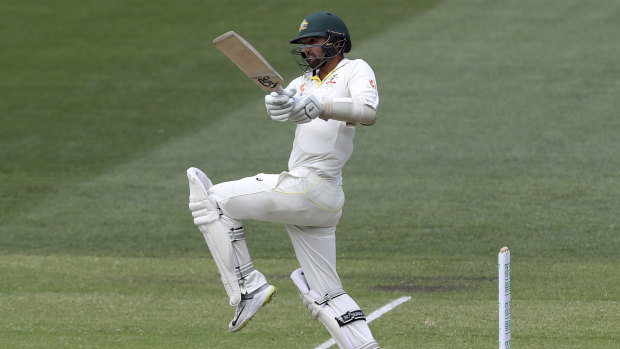 Thorn in India's side: Nathan Lyon adds to the Australian tally as they chase down an unlikely victory.