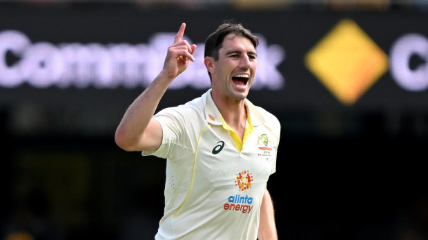 Pat Cummins celebrates one of his five second innings wickets in Brisbane.