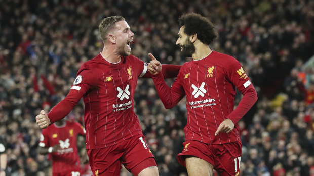 Mohamed Salah (right) celebrates his penalty in Liverpool's come-from-behind victory.