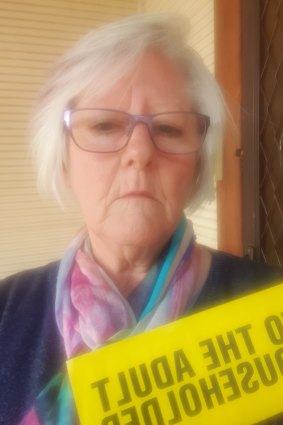 Broken Hill resident Elaine Gillett with a flyer she received from Clive Palmer.