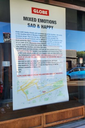 A sign on the old storefront of shoe outlet Globe on Acland Street.