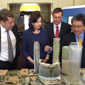 Star Entertainment CEO Matt Bekier shows Queensland Premier Annastacia Palaszczuk, then State Development Minister Anthony Lynham and Far Eastern Consortium director Chris Hoong features of the Queen’s Wharf Brisbane model.