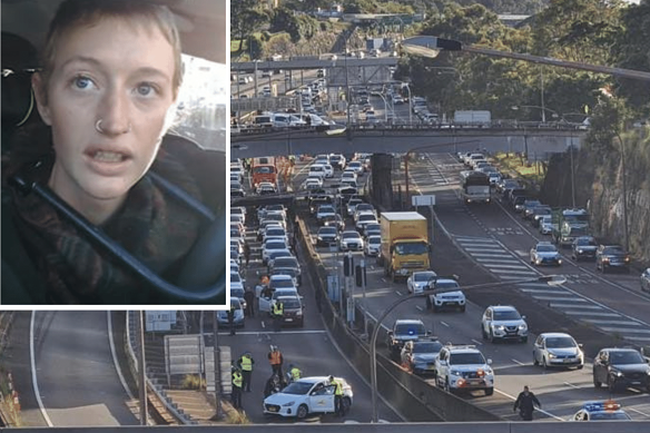 A protester used a bike lock to attach herself to a car blocking the entrance to the Sydney Harbour Tunnel.