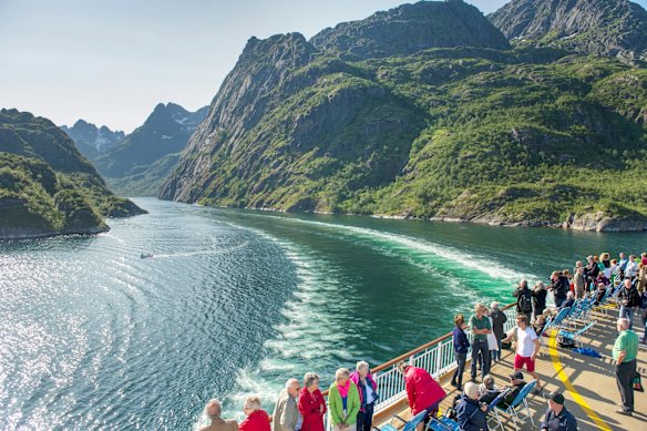 Passengers enjoy the view in Trollfjord.