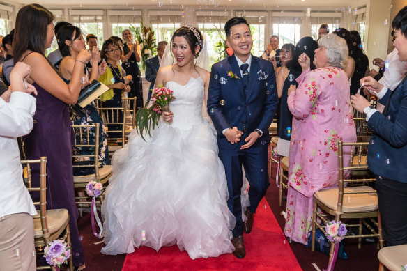 Kim Lee (right) and his wife, July Lies, on their wedding day in 2019. The couple met in 1999.