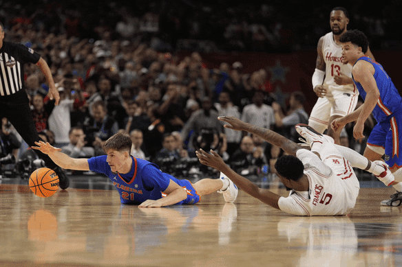 With the buzzer about to sound, Australian Alex Condon pounces on a loose ball to secure a two-point win for the Florida Gators in the 2025 NCAA championship game.