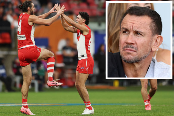 The high-flying Sydney Swans and (inset) Matthew Johns.