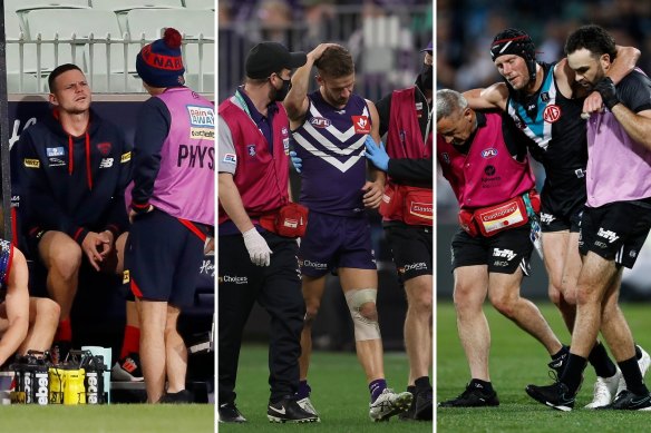 Concussions: Melbourne’s Steven May, Docker Sam Switkowski and Port Adelaide’s Brad Ebert.