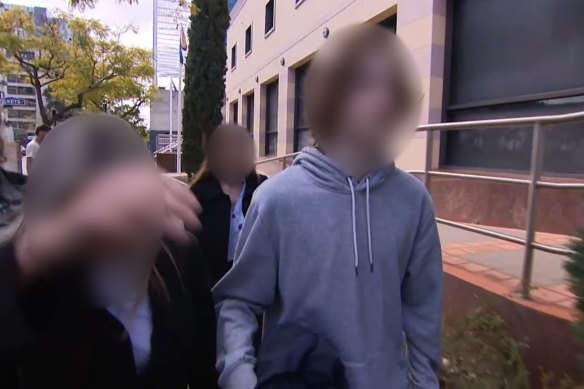 The teenager leaving Perth Children’s Court with his family on Wednesday. 