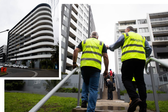 Building inspectors tour the apartment complex on Charles St Canterbury, where structural concerns have emerged this week.