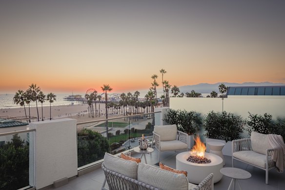 A hotel suite, complete with balcony and gas fire.